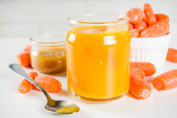 A vibrant pack of Sidekicks Orange Obsession Gummies with fresh oranges in the background.