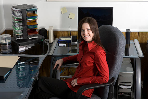 EmiliePTurner in her art studio, surrounded by her creative works.